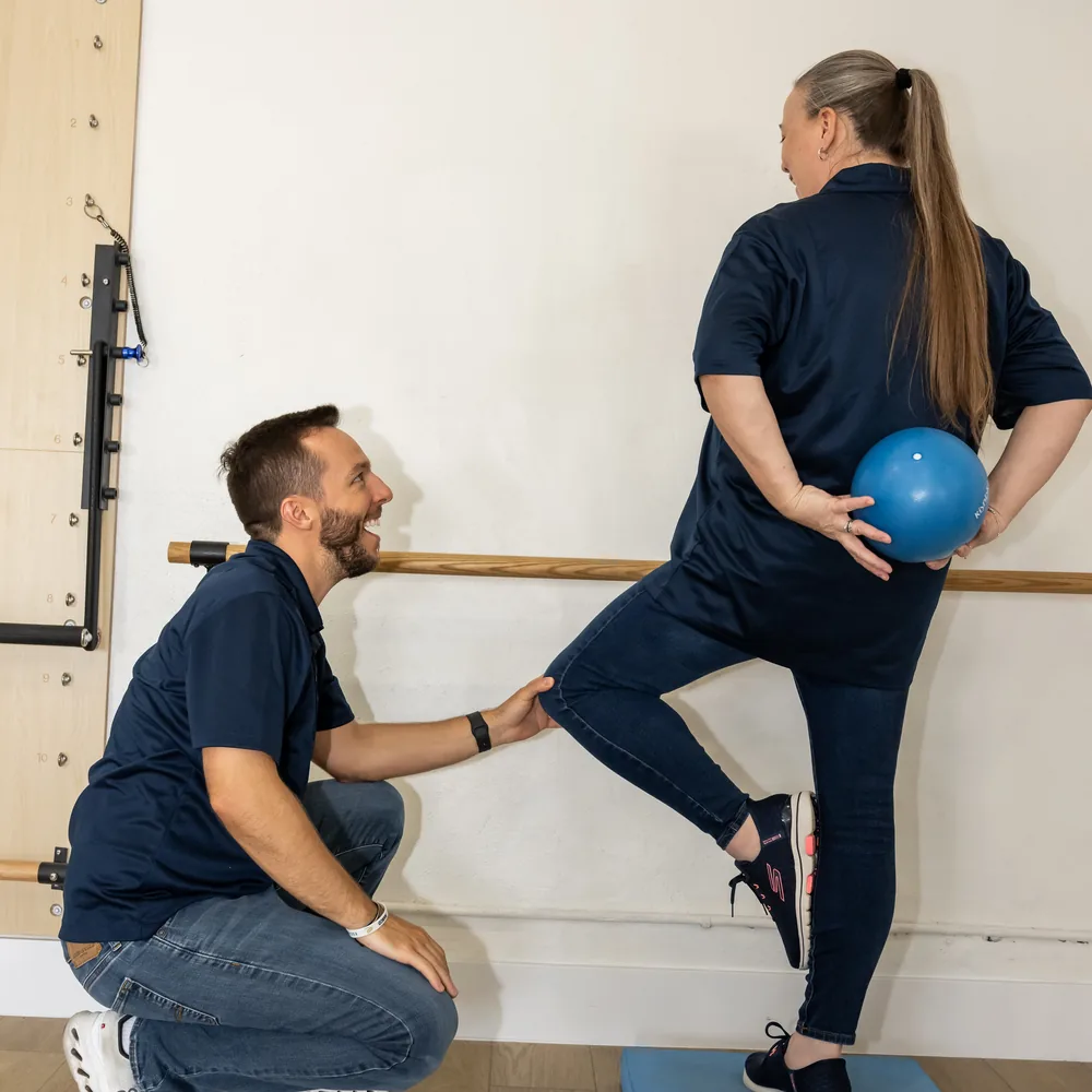 Therapist working with a client on balance & vestibular