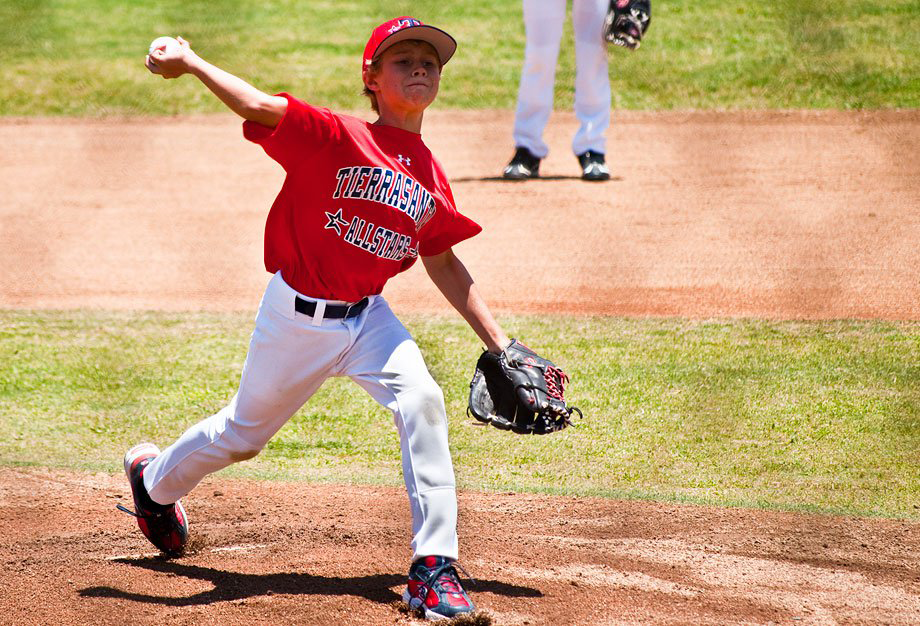 A baseball player throwing a ball

Description generated with very high confidence